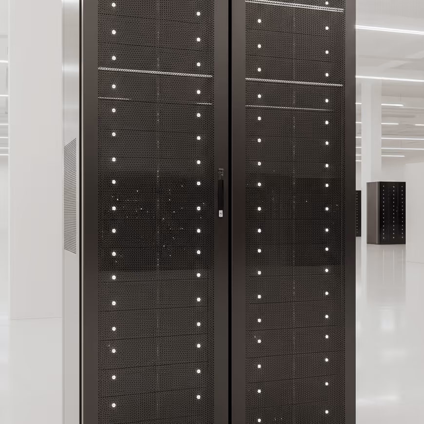 Tall black server racks with numerous small indicator lights in a bright, modern data center room.