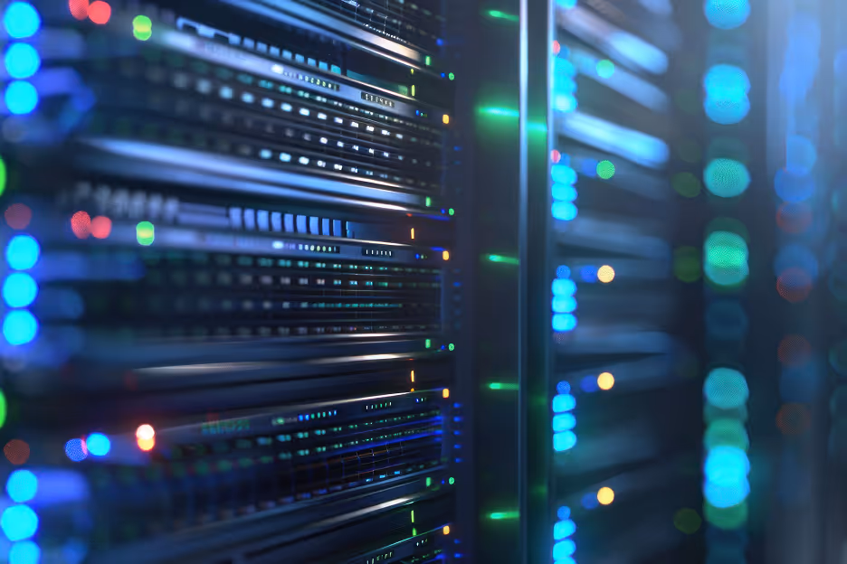 Close-up of server racks with illuminated LED lights in a data center.