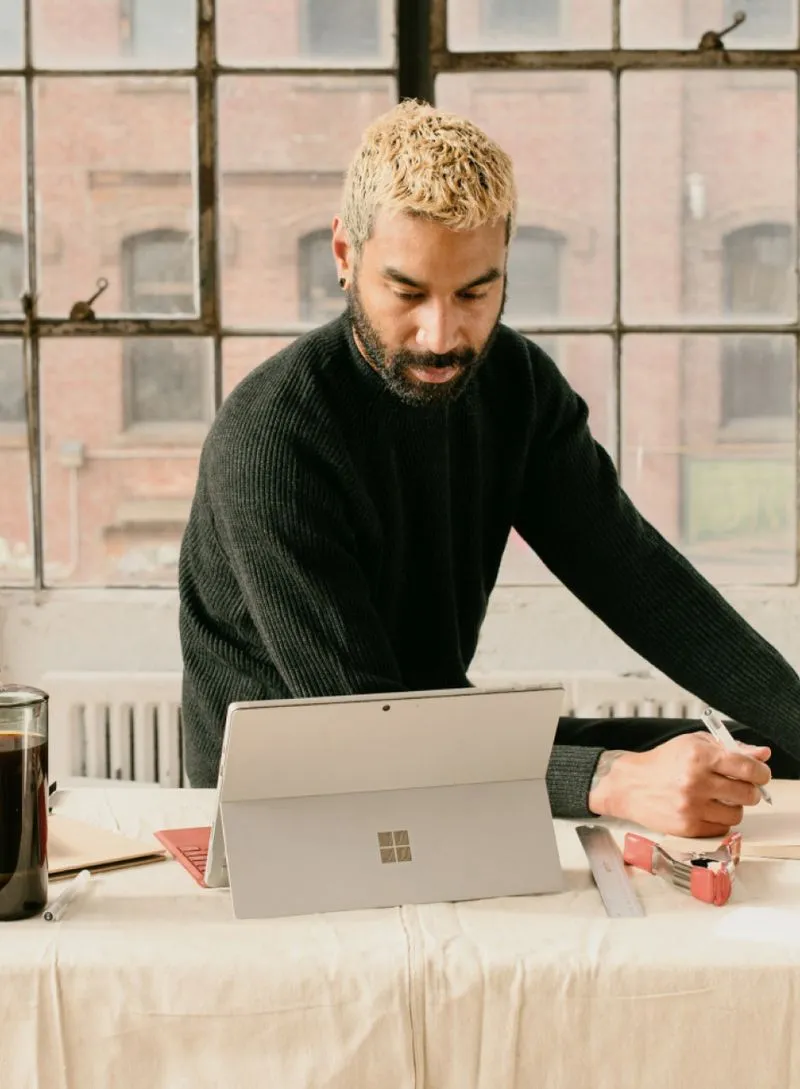 A man is looking on tablet.