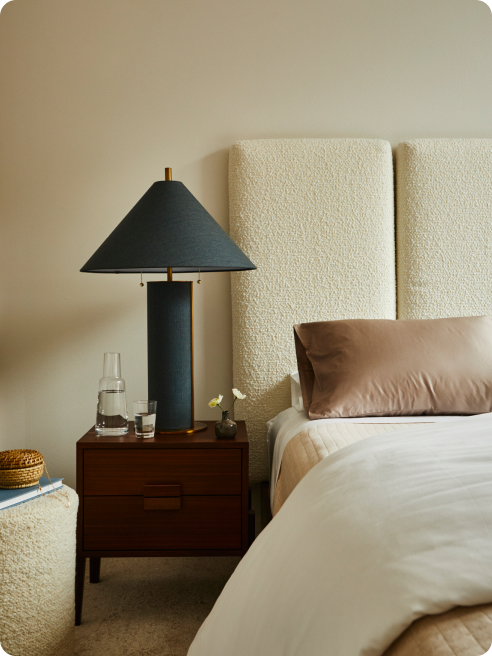 Neutral’s clear water on a wooden bedside table