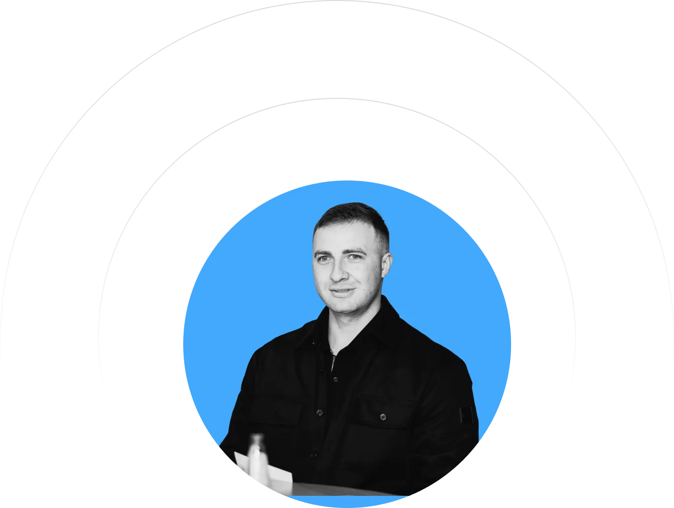 A man in a black shirt is in a blue circle.