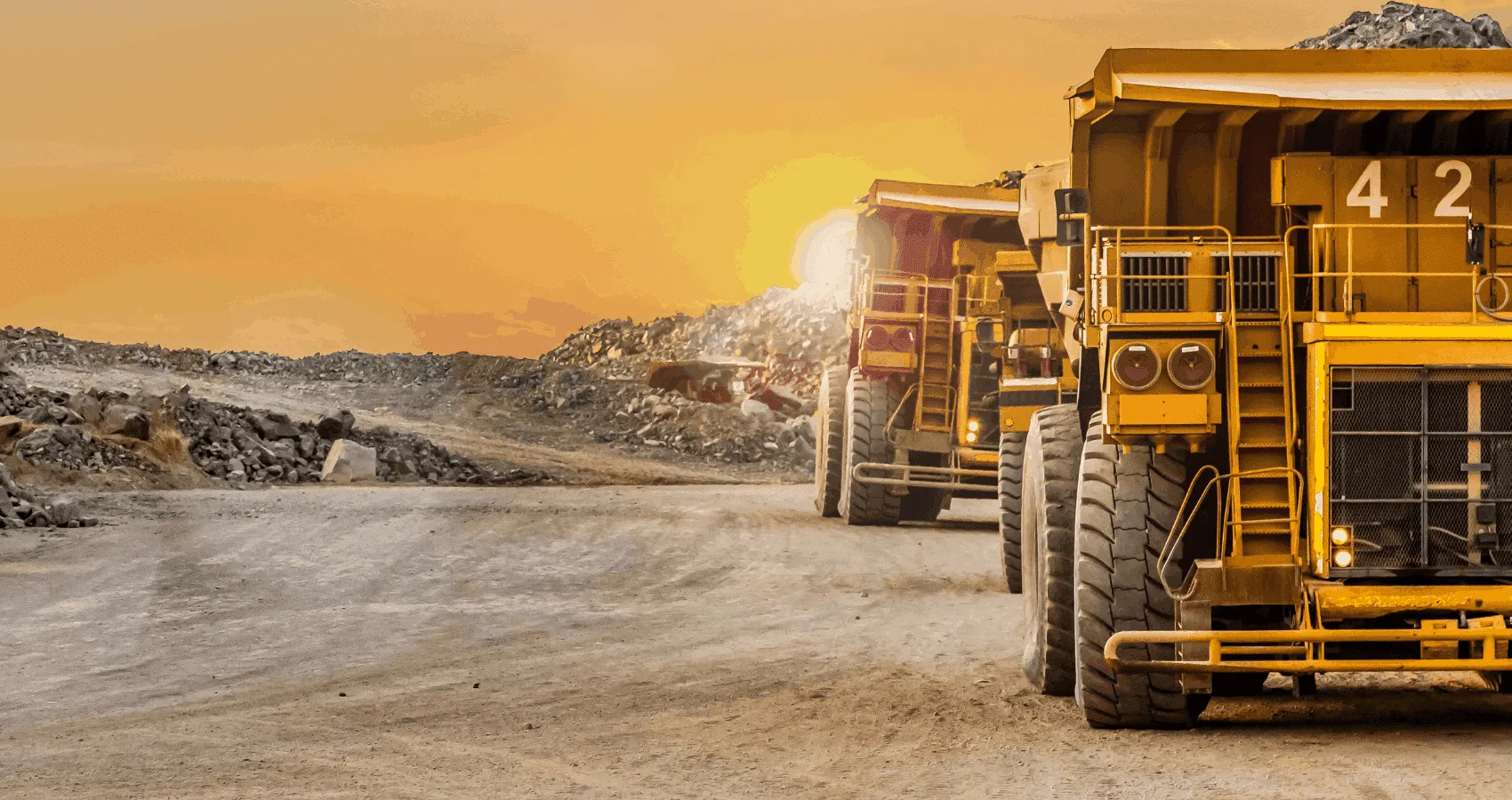 Large yellow mining trucks.