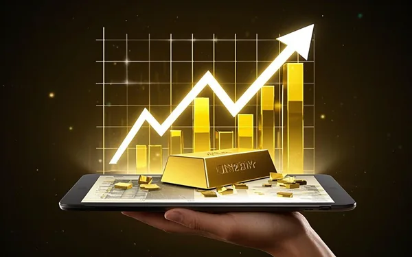 A hand holding a tablet with a gold bar and small gold pieces on top, with a bright upward graph and bar chart in the background, representing financial growth and investment in gold.