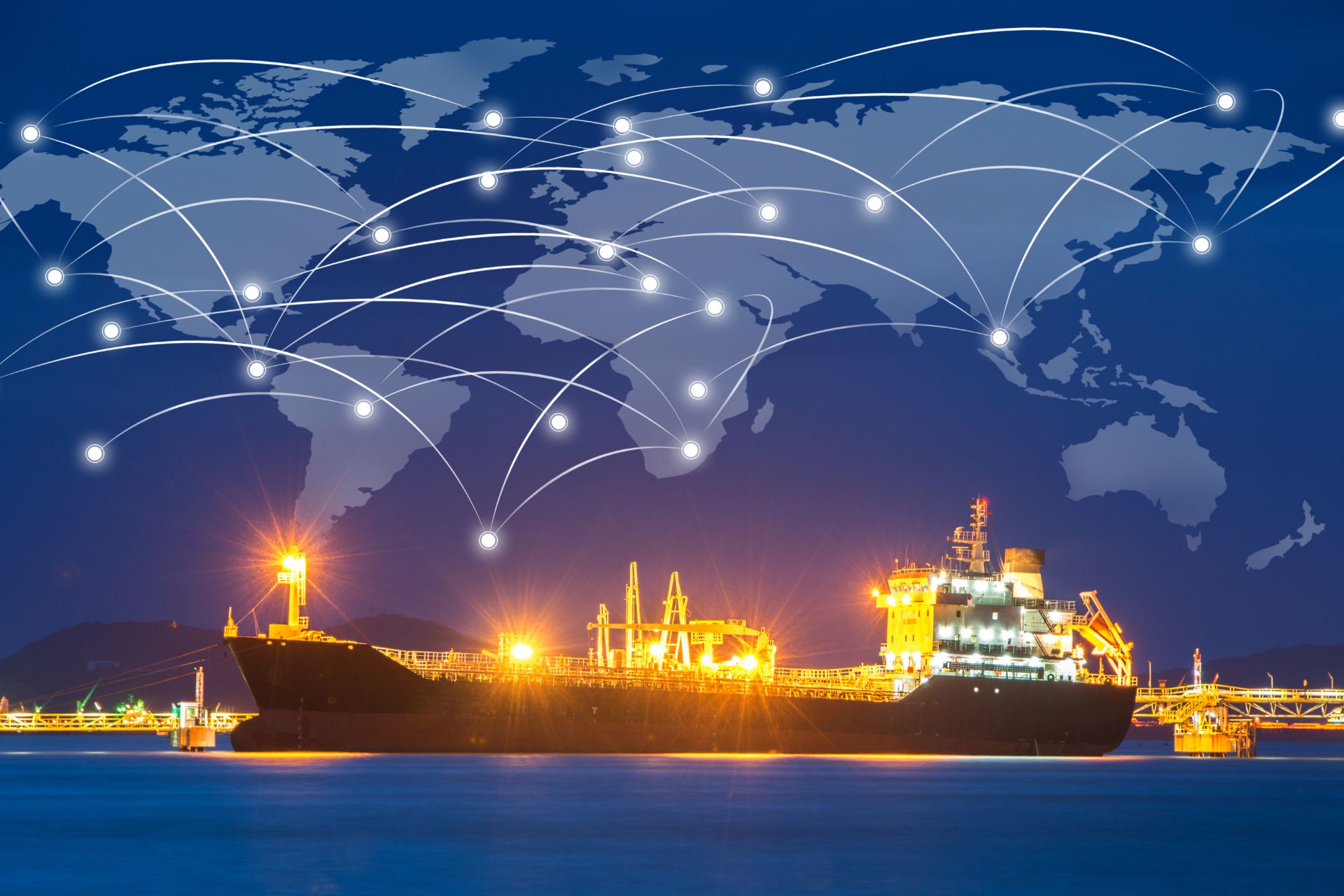 A cargo ship docked at night with global shipping routes and network connections overlaid, symbolizing international trade and logistics.