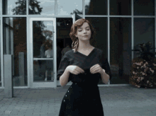 A GIF of a woman walking while putting on sunglasses with text overlay that says "Like a Boss"