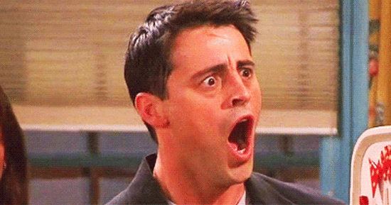 A GIF showing the character of Joey Tribbiani from the show Friends getting shocked with an open mouth gesture.