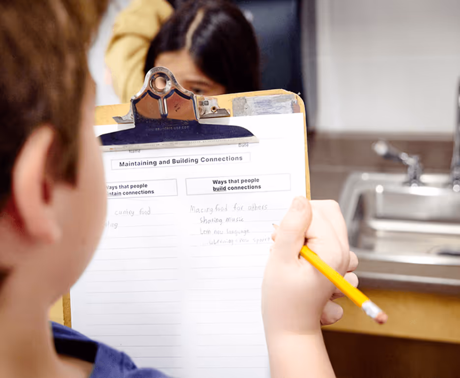 student filling in worksheet