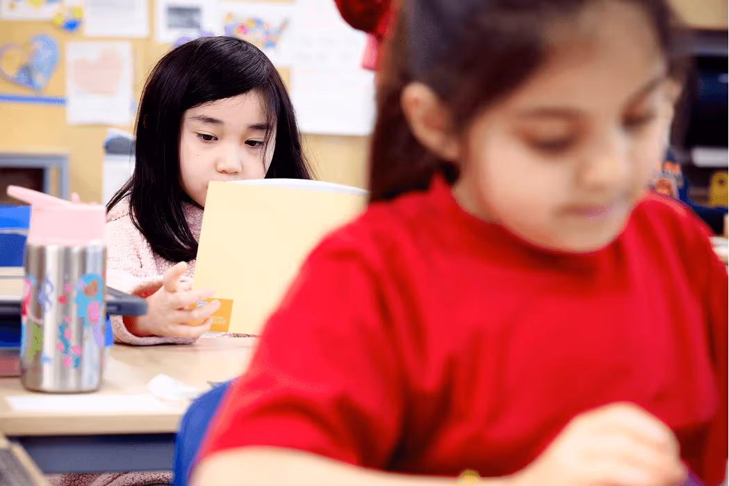 kid looking at book