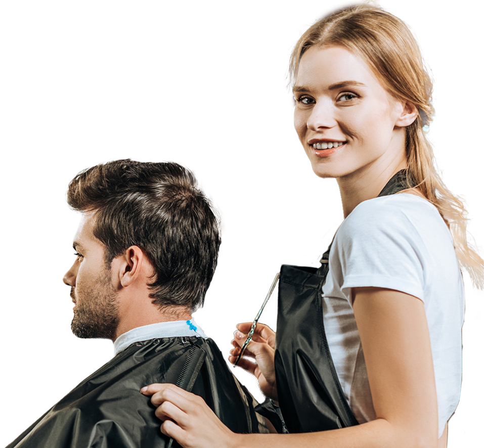 Smiling female hairstylist holding scissors and comb cutting man's hair in black cape.