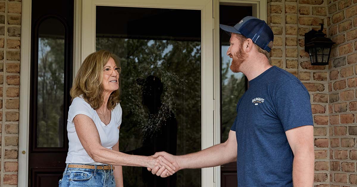 A septic technician interacting with a customer