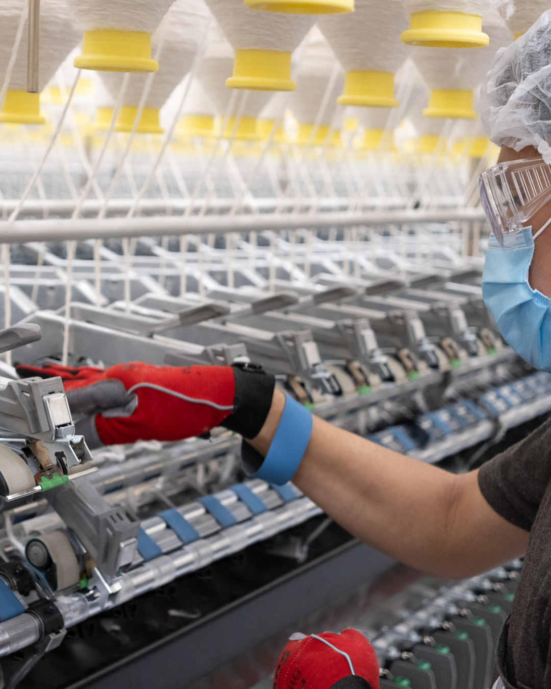 Close-up of a Lectra Vector Fashion cutting machine slicing fabric with pattern outlines.