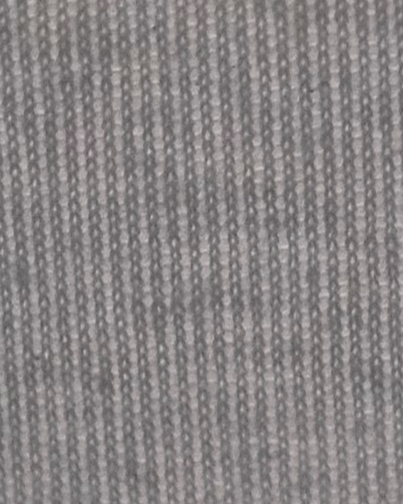 Close-up of water droplets on a textured blue and white surface with a blurred blue background.