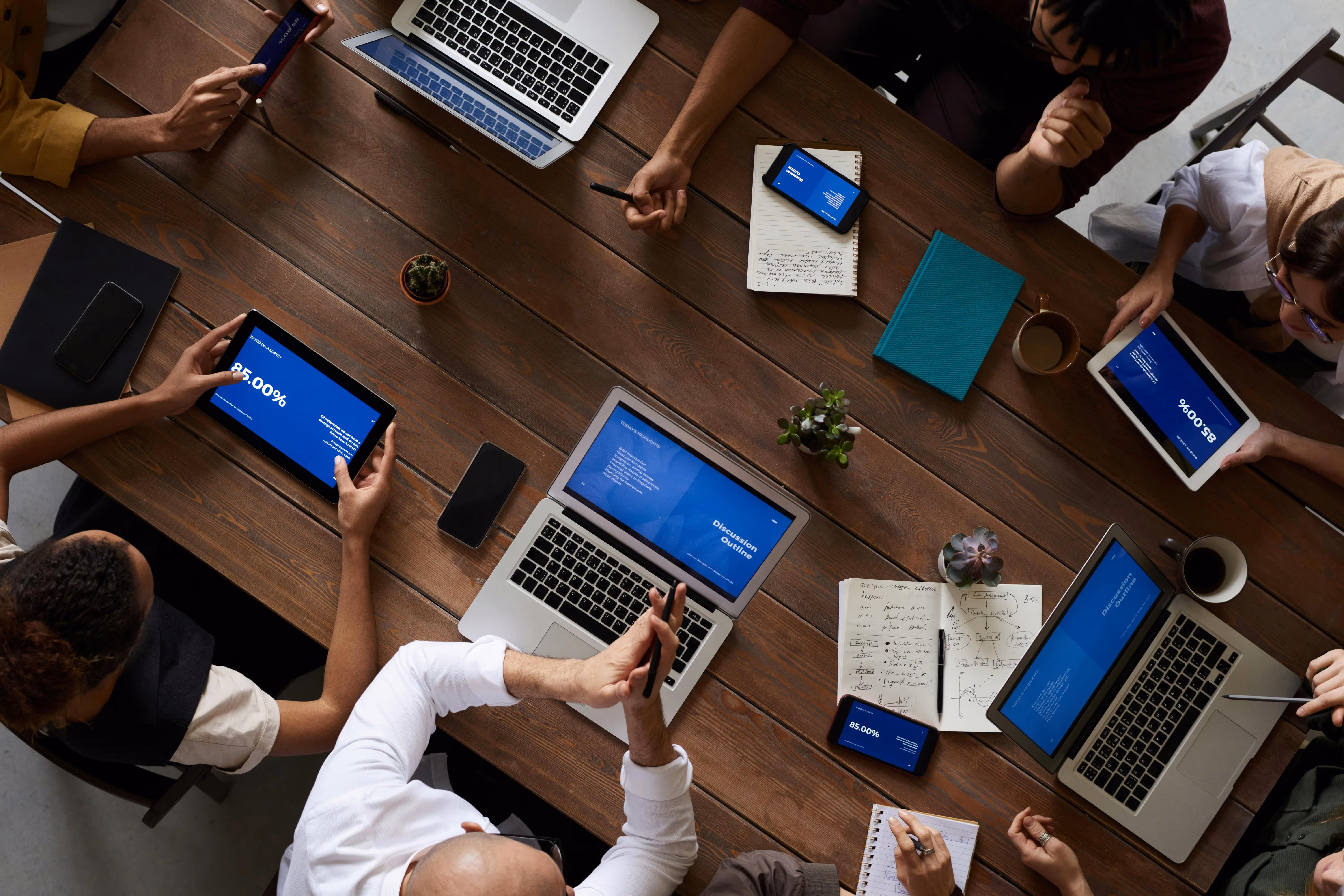 Business meeting with people around a table trying to improve user experience.