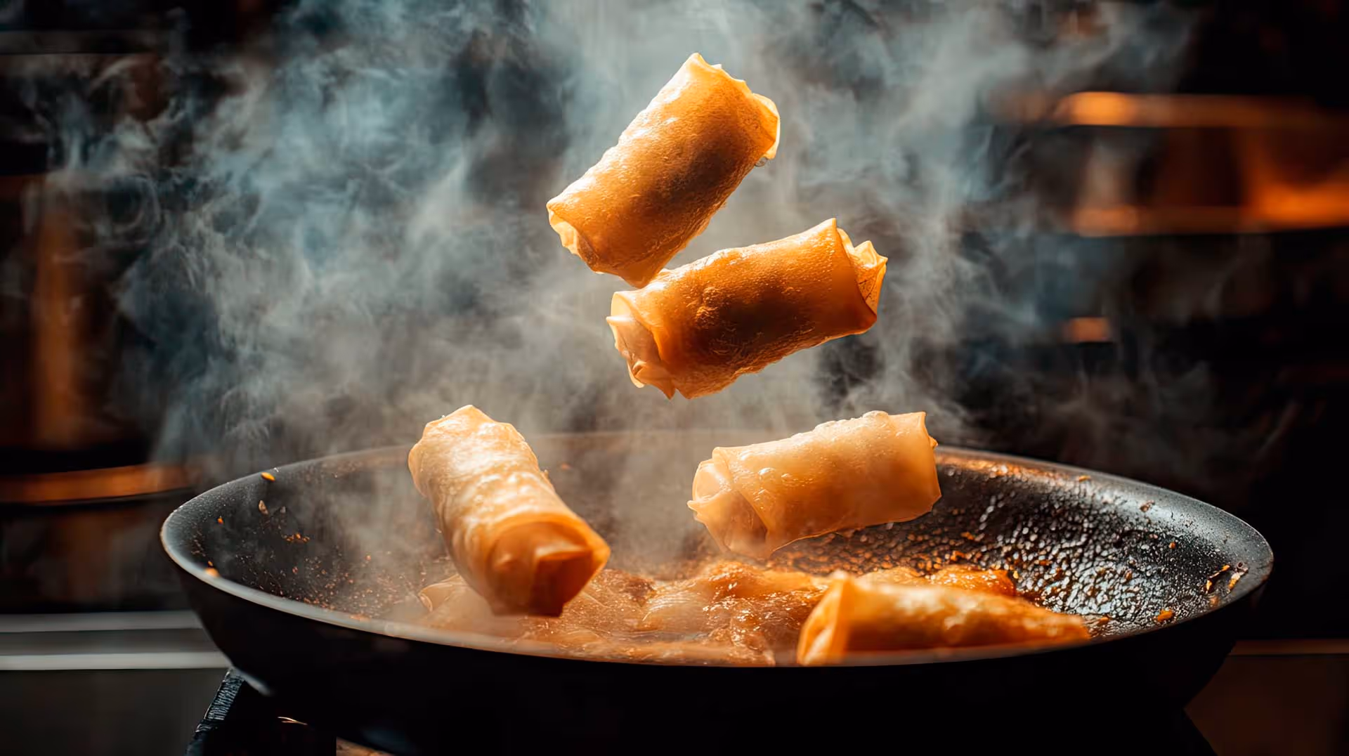 A frying pan filled with food being cooked, with steam rising, indicating a flavorful dish is being prepared.