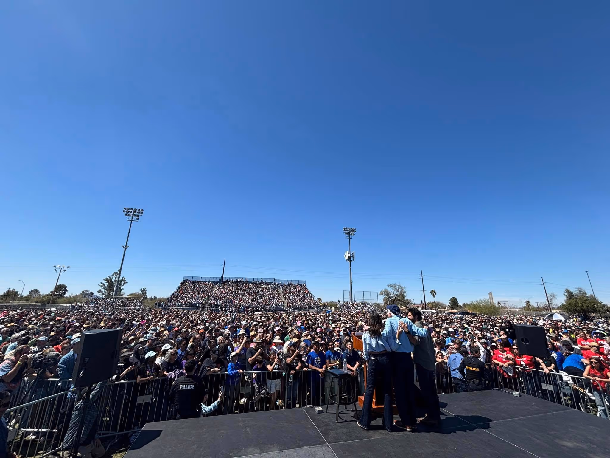 A large crowd gathers for a political rally