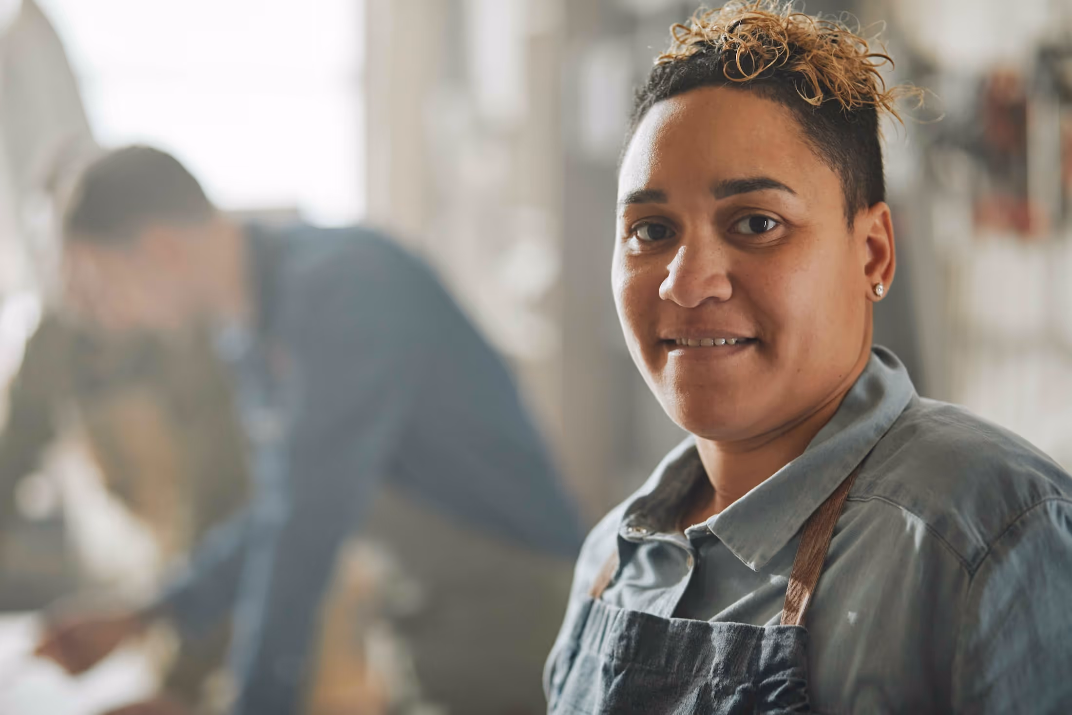 A person smiles at the camera