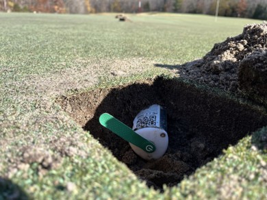 Spiio GCX soil sensor installed at the center of a trial plot on Green 4