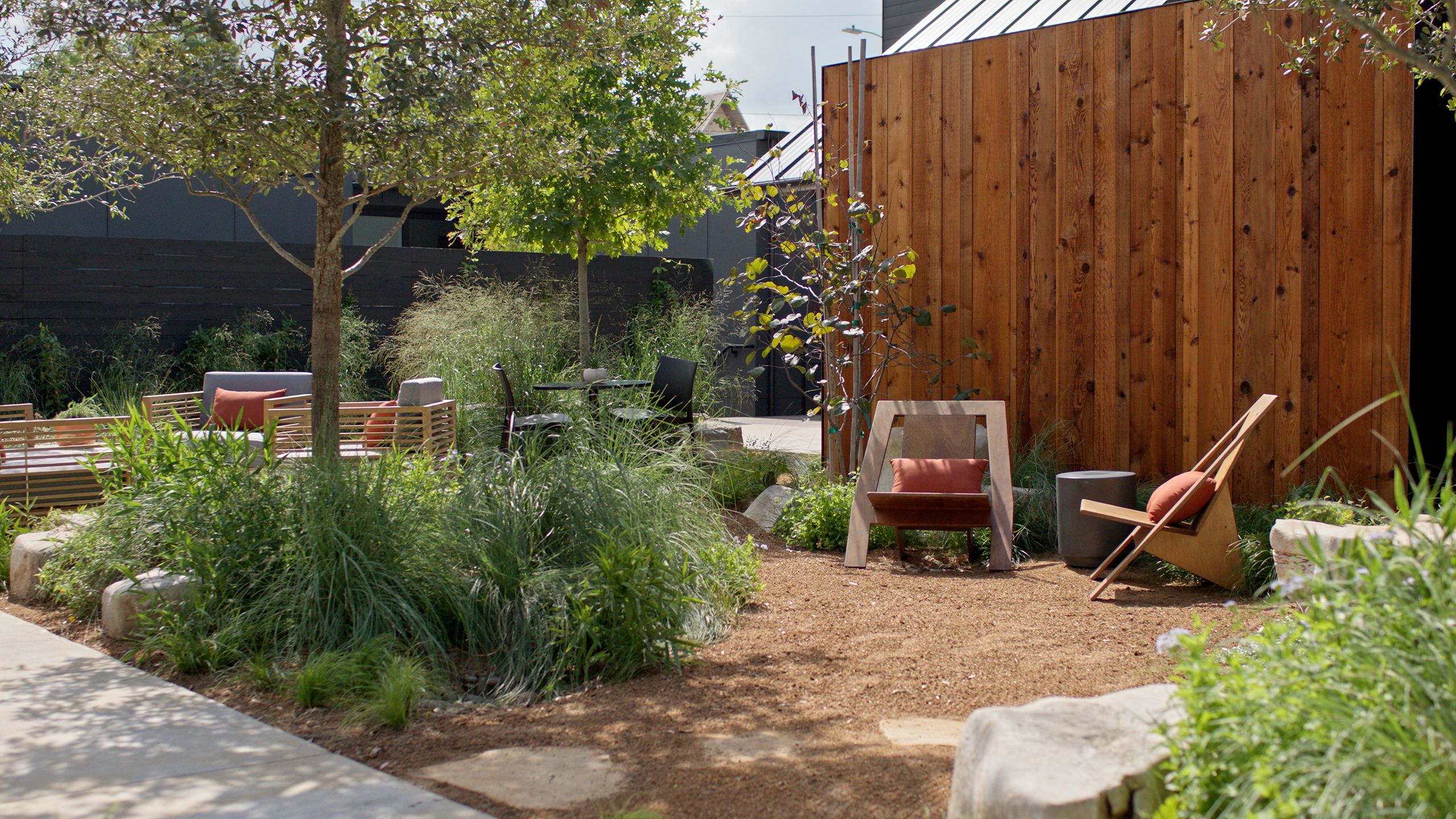 Image may contain: Backyard, Nature, Outdoors, Yard, Indoors, Interior Design, Garden, Grass, Plant, Chair, and Furniture