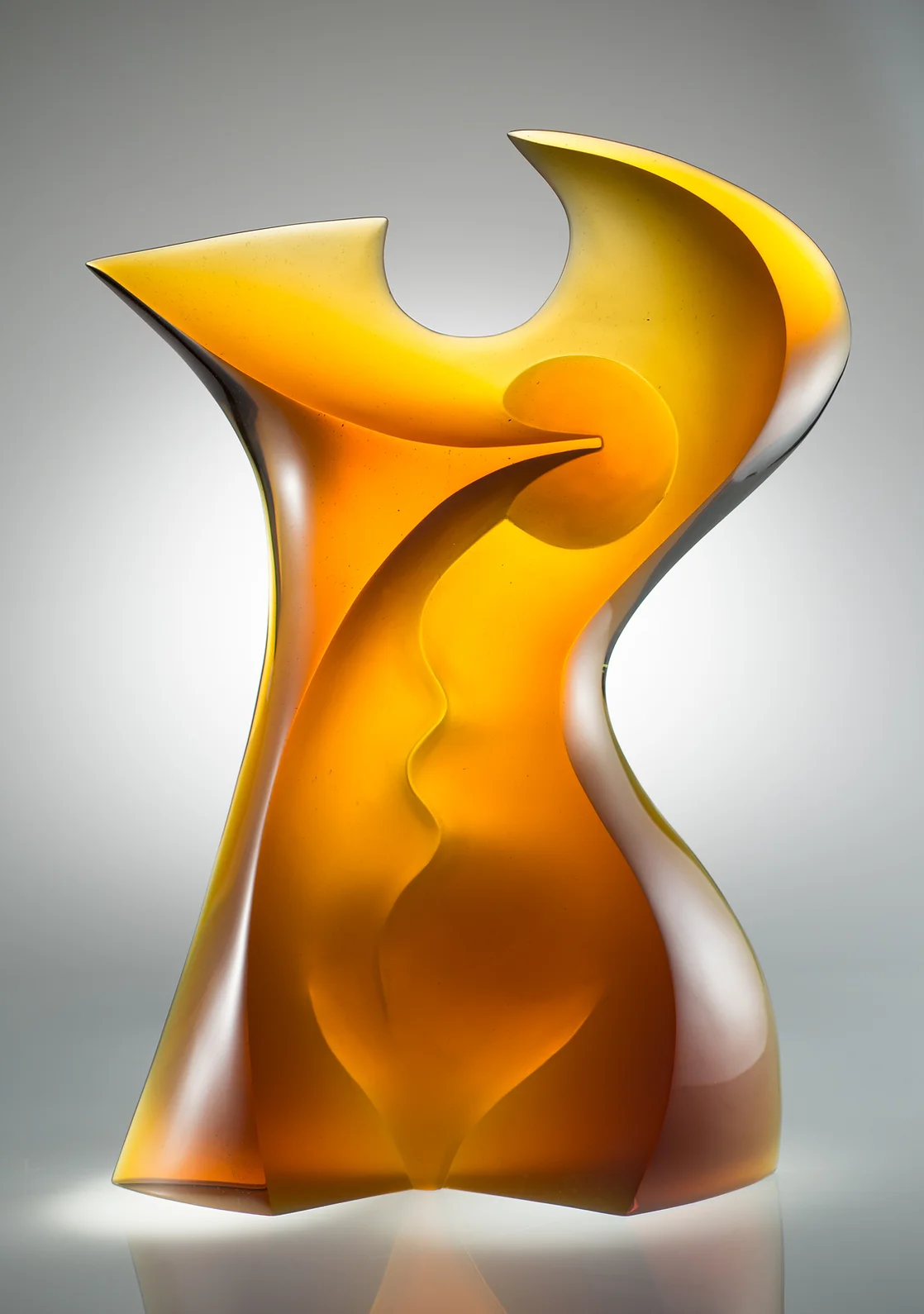 Orange-yellow sculpture displayed in gallery