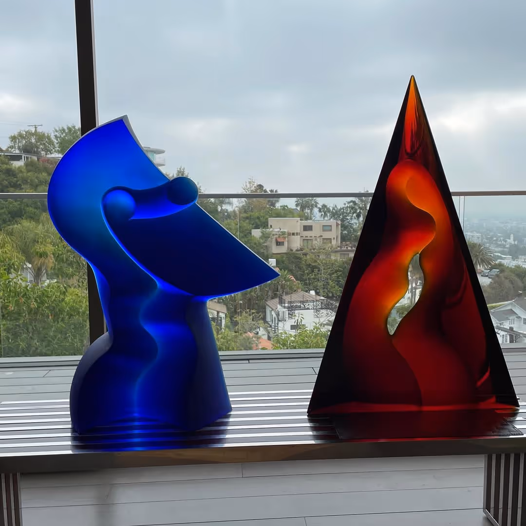 Blue and red glass sculptures in a clean and simple indoor environment