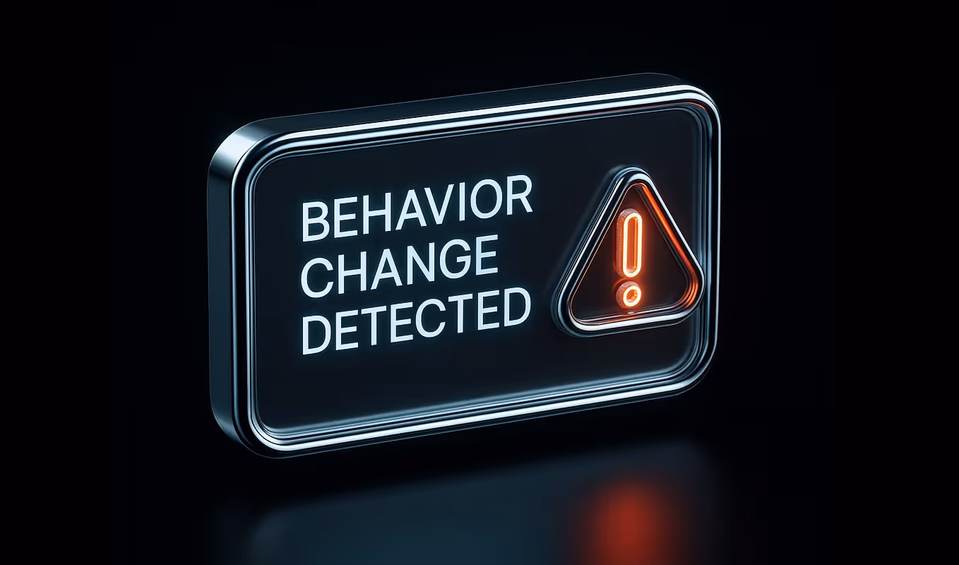 A digital sign reading “Behavior Change Detected” with a red alert icon, illustrating early detection of out-of-pattern insider actions before they escalate.