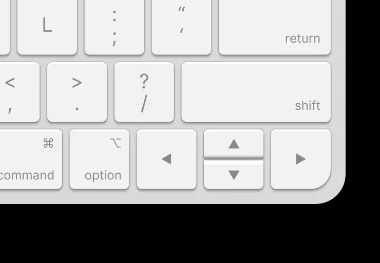 Close-up of a Mac keyboard with arrow, shift, and return keys in focus, illustrating Accreditex’s keyboard-first interface for fast navigation between market entities without using a mouse.
