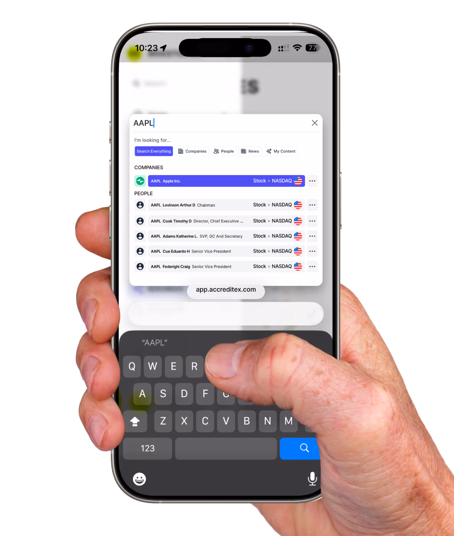 A hand holding a phone showing the Accreditex mobile search interface with a query for “AAPL” and matching results for the company and related insiders, including their roles and exchange listings.