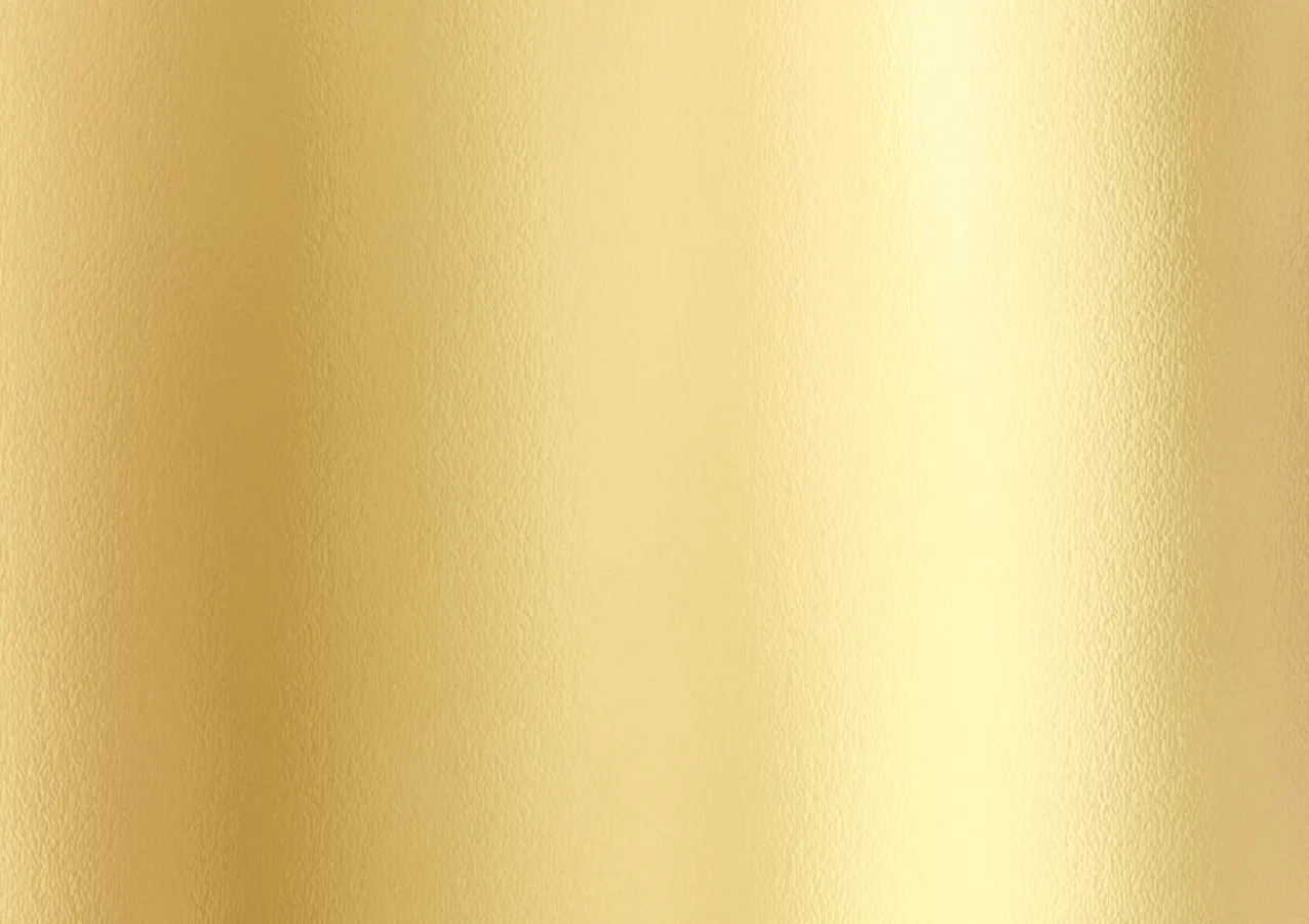 A close up view of a gold metallic surface.