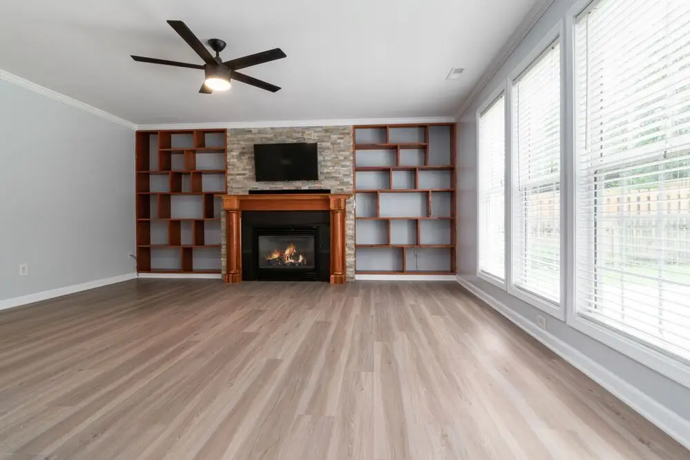 Luxury vinyl plank living room modern warm tone renovation Surrey White Rock Langley BC