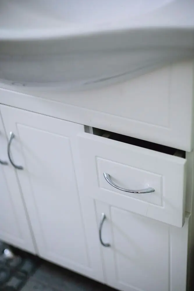 kitchen cabinet brushed chrome pulls modern warm" on Unsplash or Pexels | Alt text: "Kitchen cabinet brushed brass pulls modern renovation Surrey White Rock Langley BC