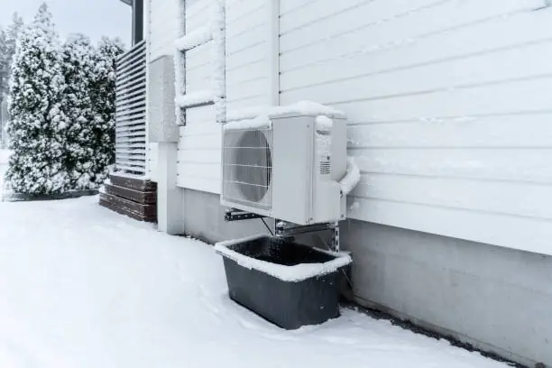 Heat pump outdoor unit winter frost coastal climate Surrey White Rock Langley BC