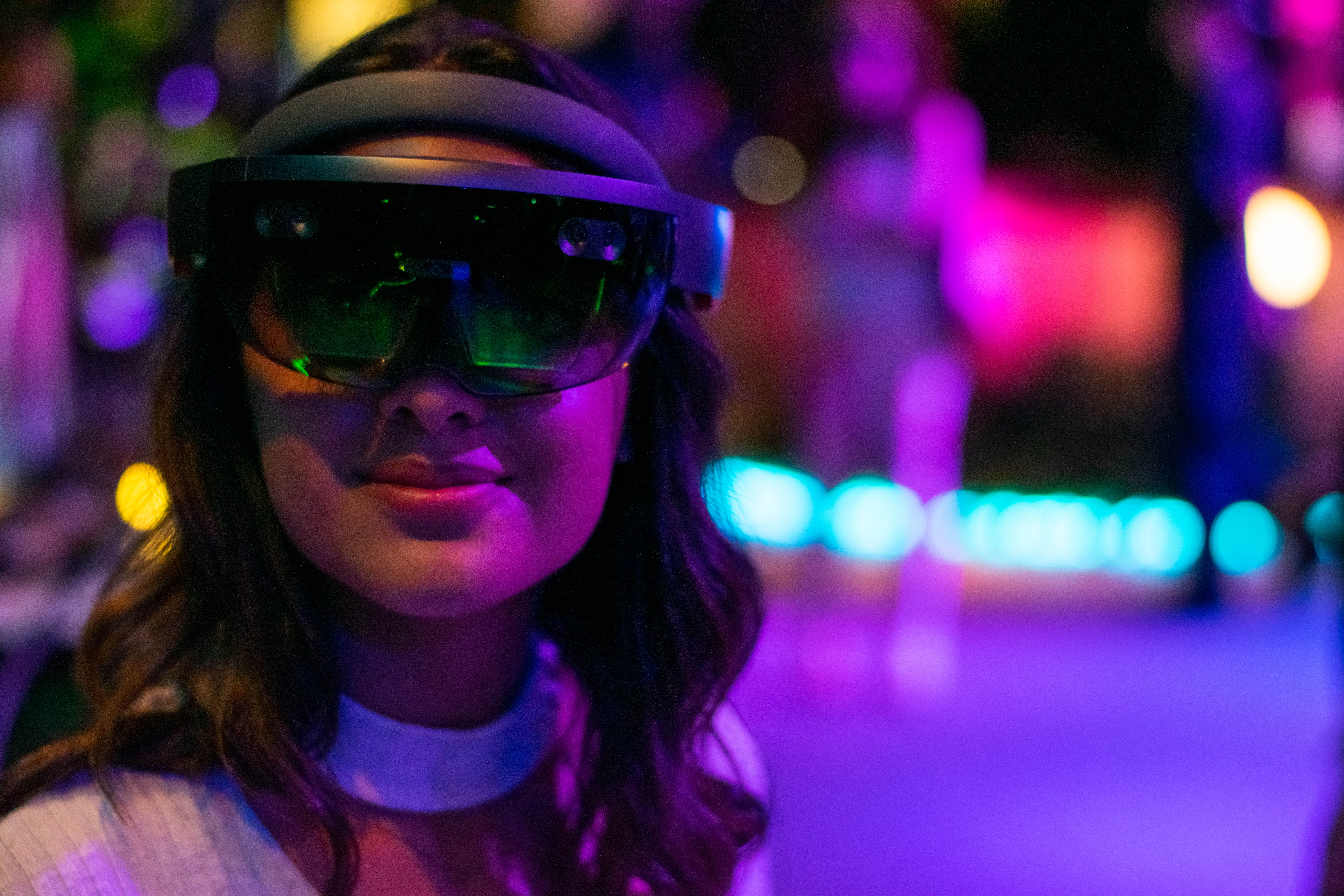 A girl wearing an AR headset at Verse Immersive
