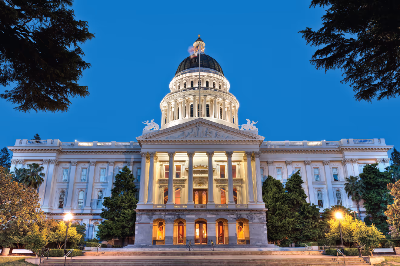 Front view of the California State Capitol building in Sacramento at dusk