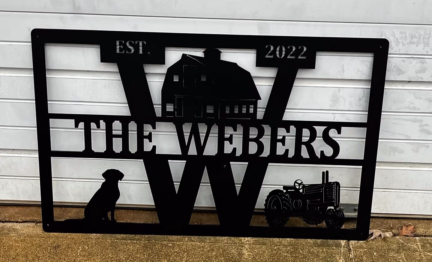 Black Metal Yard sign that says "the webers"