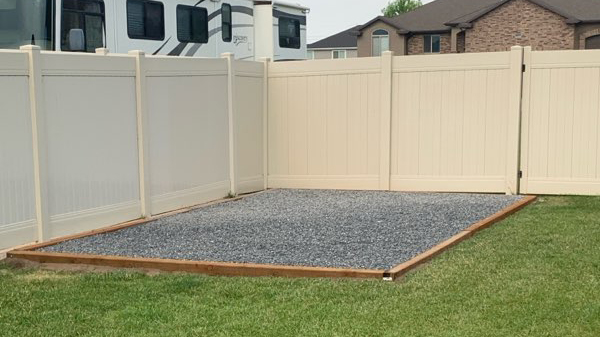 Narrow backyard gate and cluttered access path with overgrown plants and stored items that could create shed moving obstacles