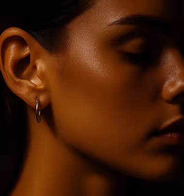 Close-up of a woman's serene face showcasing natural beauty, highlighting the quality of treatments at Natural Beauty by Helen.