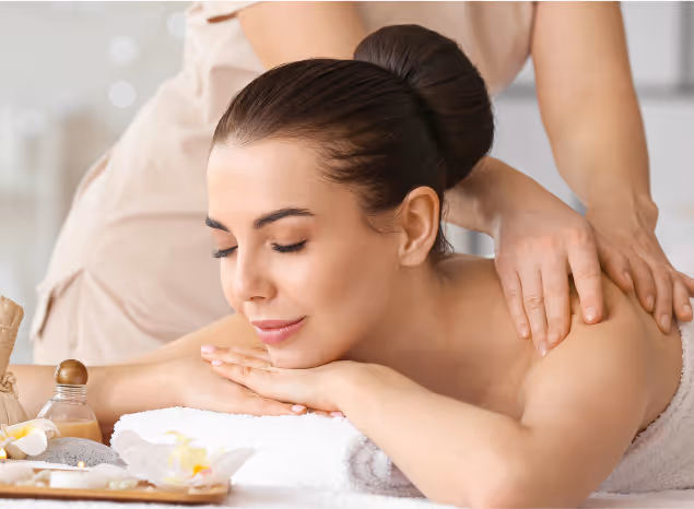 Relaxing beauty treatment with a woman enjoying a massage in a calming spa environment at Natural Beauty by Helen in Twickenham.