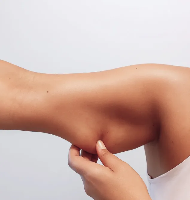 A person receiving a holistic body sculpting treatment at Natural Beauty by Helen, a wellness clinic in Twickenham, London.