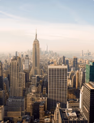 Panoramic view of the New York City skyline featuring the Empire State Building.