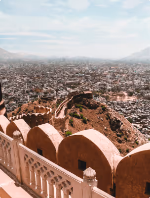 Scenic overlook of a historic city landscape from a fortress wall near an ActionLife destination.