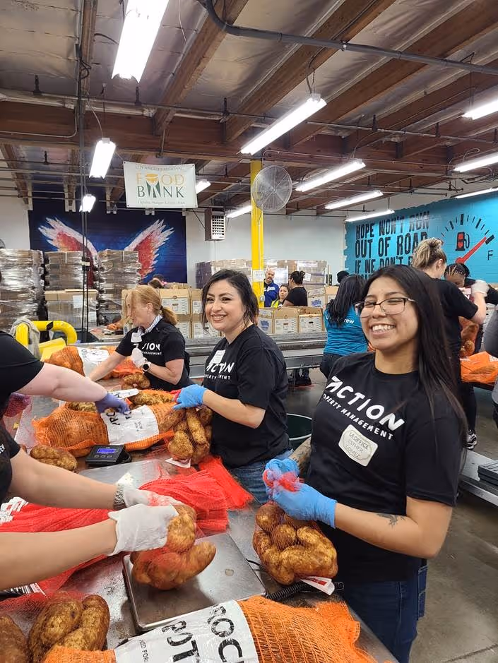 ActionLife team members packing food donations during a community volunteer event.