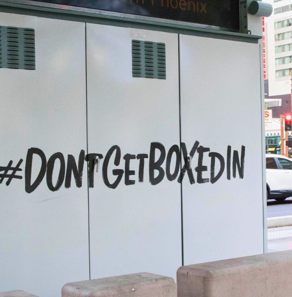 Photo of electrical box with hashtag phrase on the side saying "Don't get boxed in".