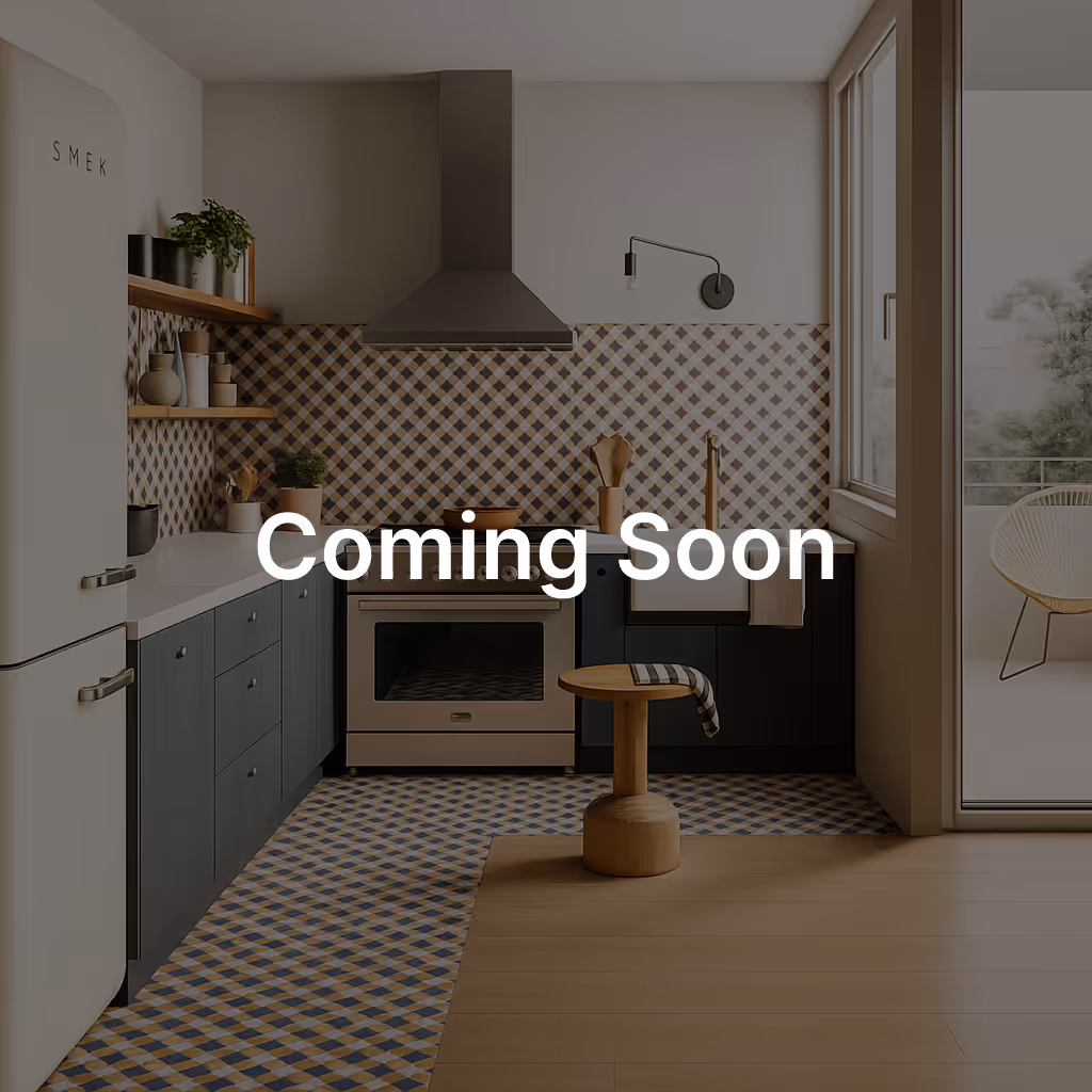  A retro-style kitchen with a blue and yellow tiled backsplash and floor, featuring a "SMEG" refrigerator and dark blue cabinets. The text "Coming Soon" is overlaid in large, white letters in the center of the image.