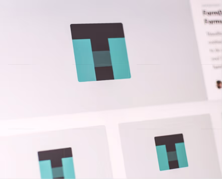 Logo design concepts displayed on a screen.