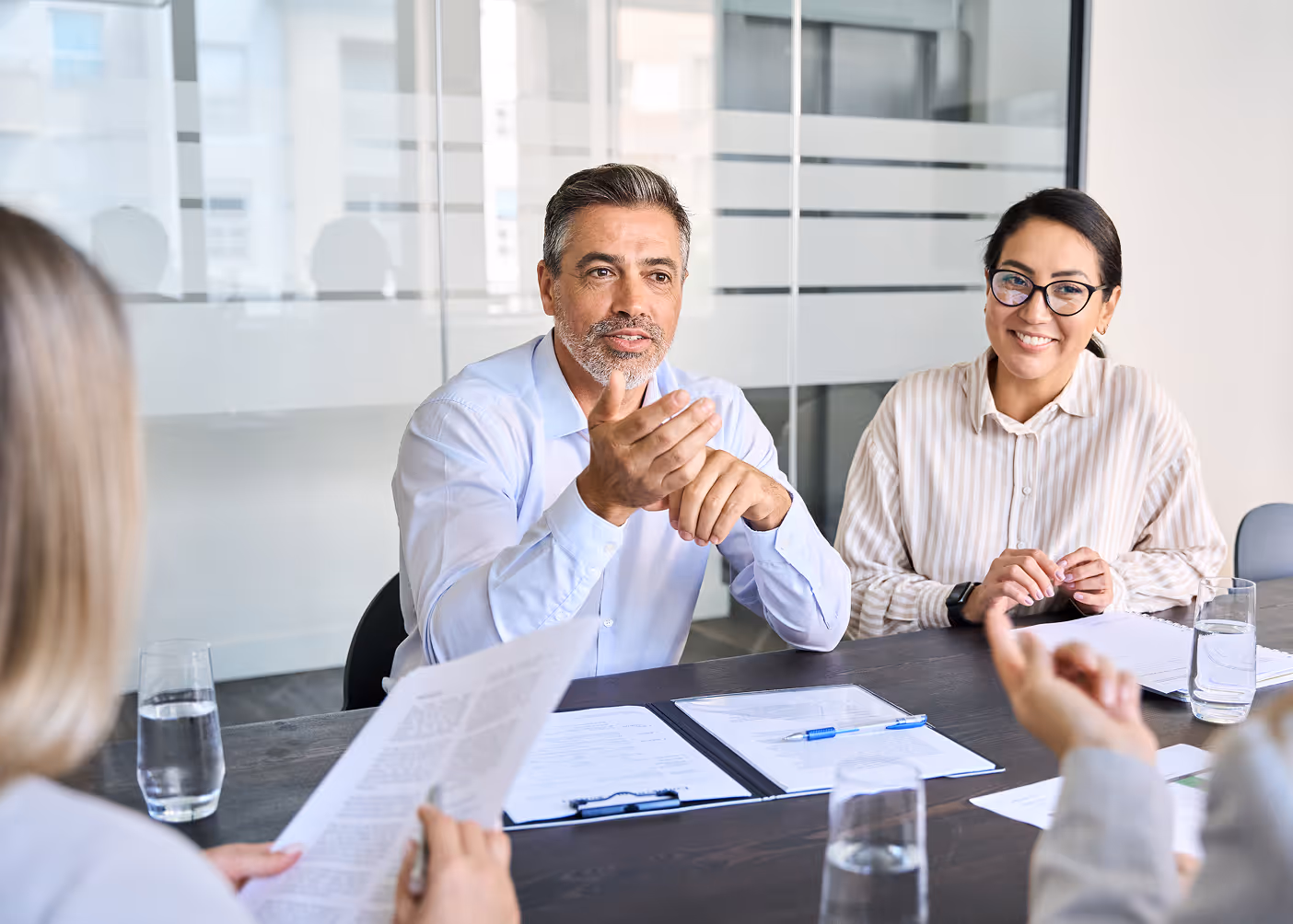 people in an office talking
