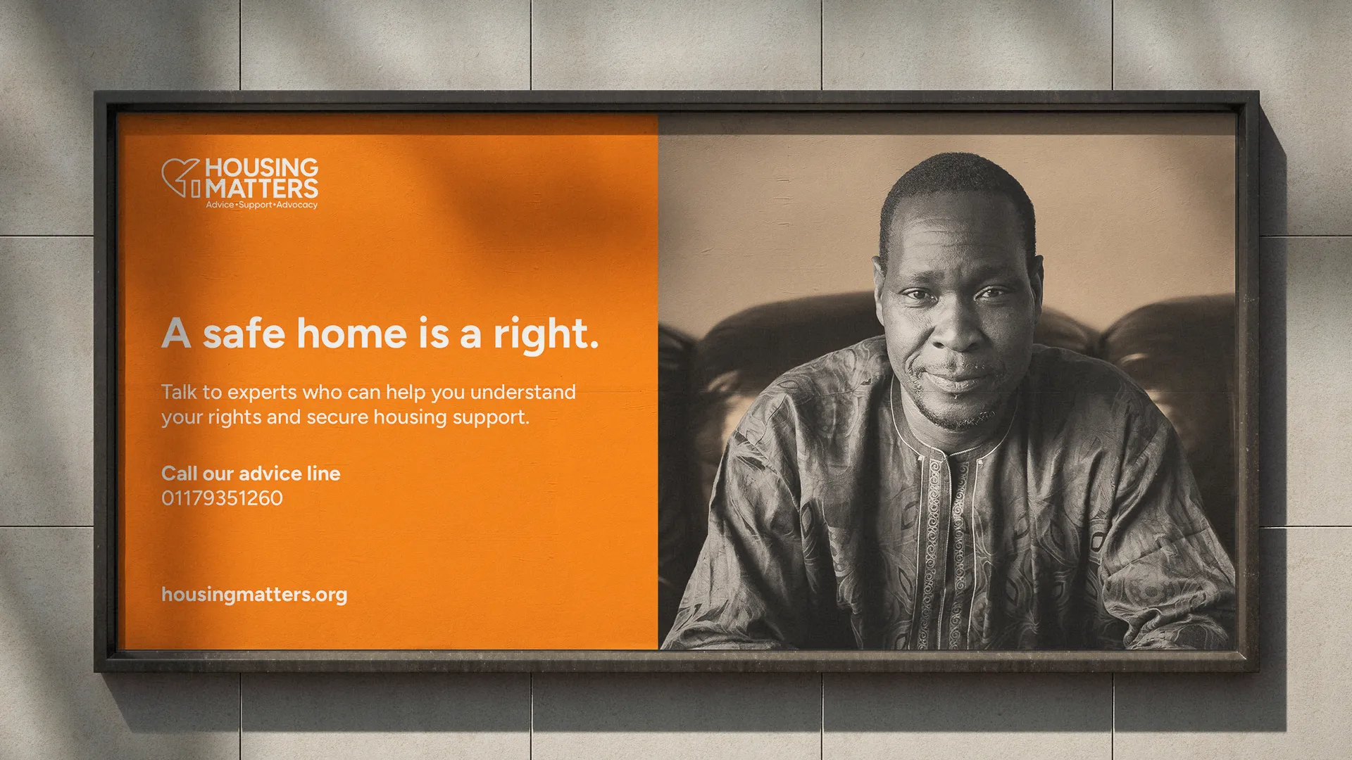Housing Matters ad with a man on the right and text about a safe home being a right on orange background.