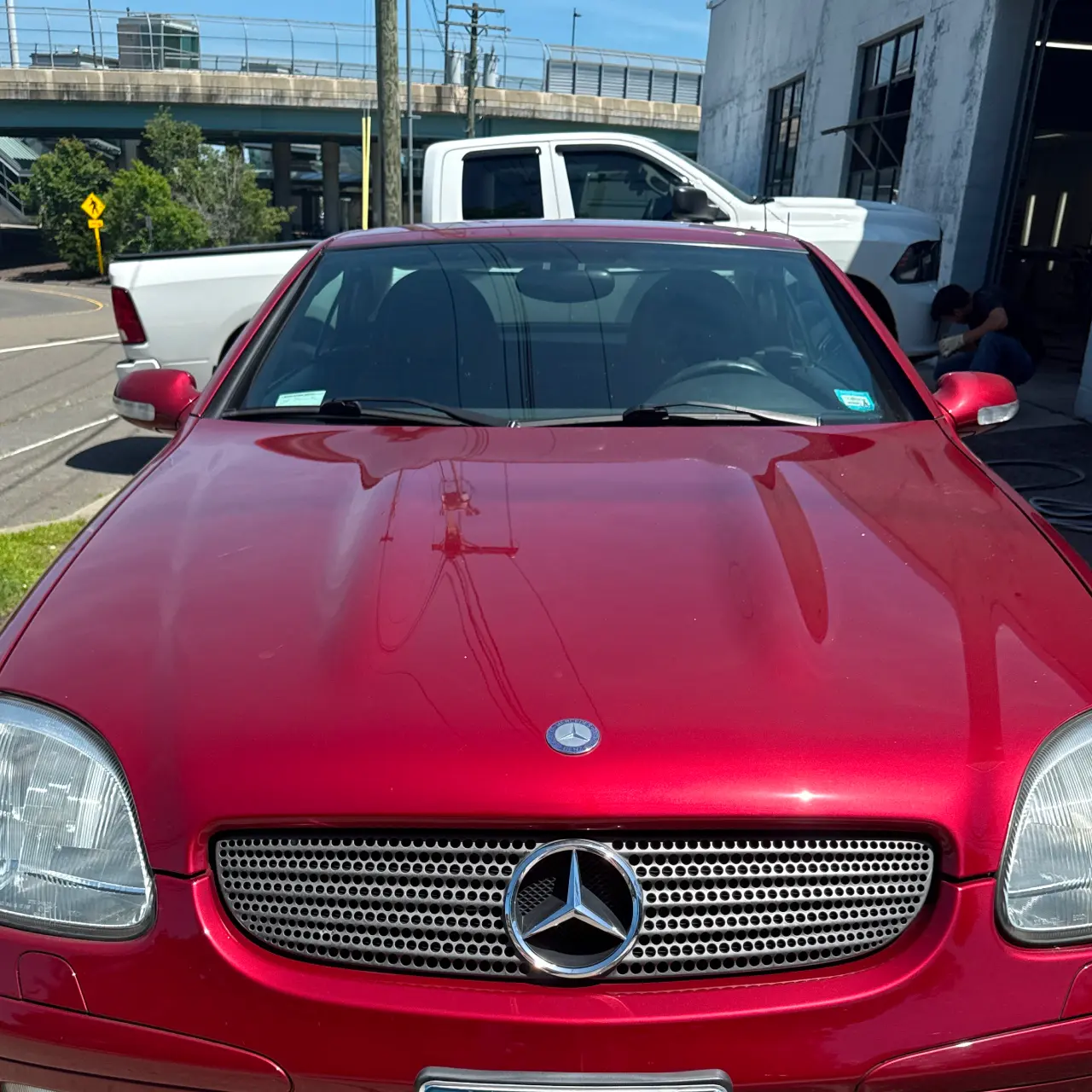A closeup of a red Mercedes-Benz sports car.