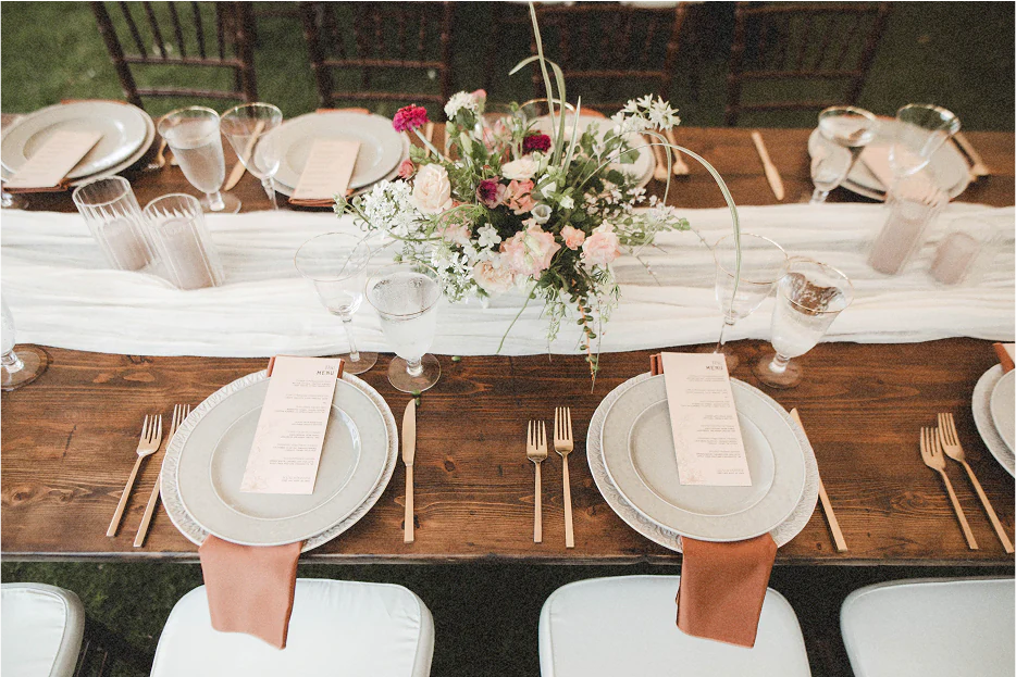 Table with place setting and wedding decor.