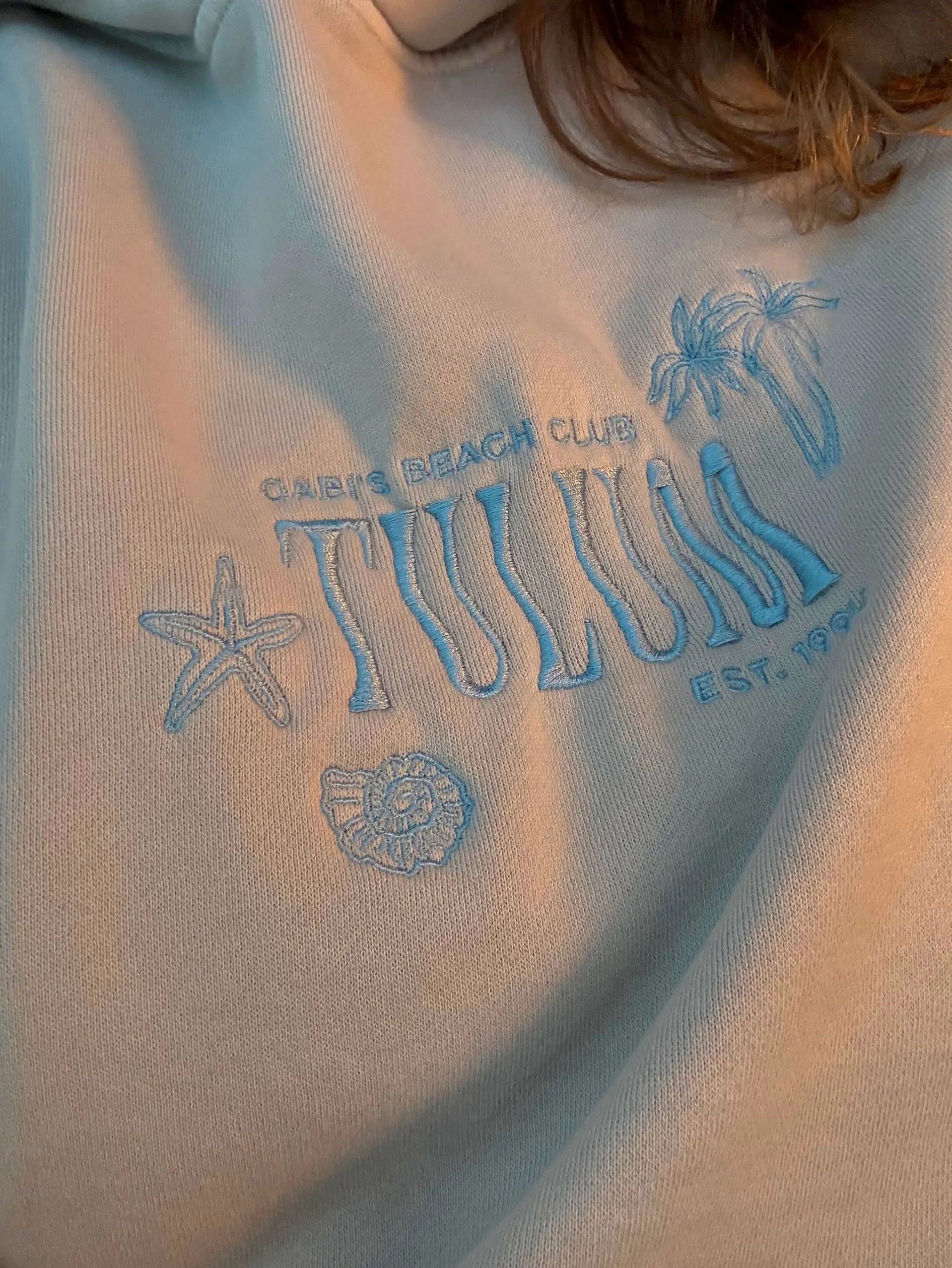 Gabi's Beach Club Tulum sweatshirt.