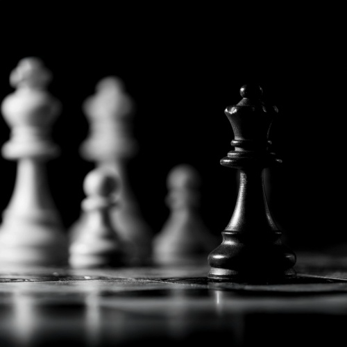 A chess board with the queen highlighted to denote strategy